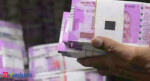 Rupee gains marginally against US dollar