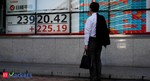 Asian shares on edge in choppy trading, dollar holds gains