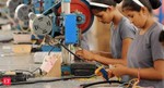 Migrant workers return to textile exporting hubs as Covid cases decline