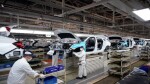 Their new factories are ready to roll but auto companies slam on the brakes
